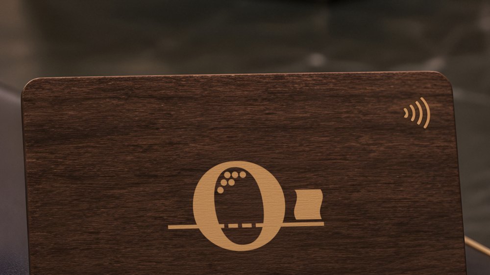 The walnut OAK Card, laser-engraved with the Dimple O